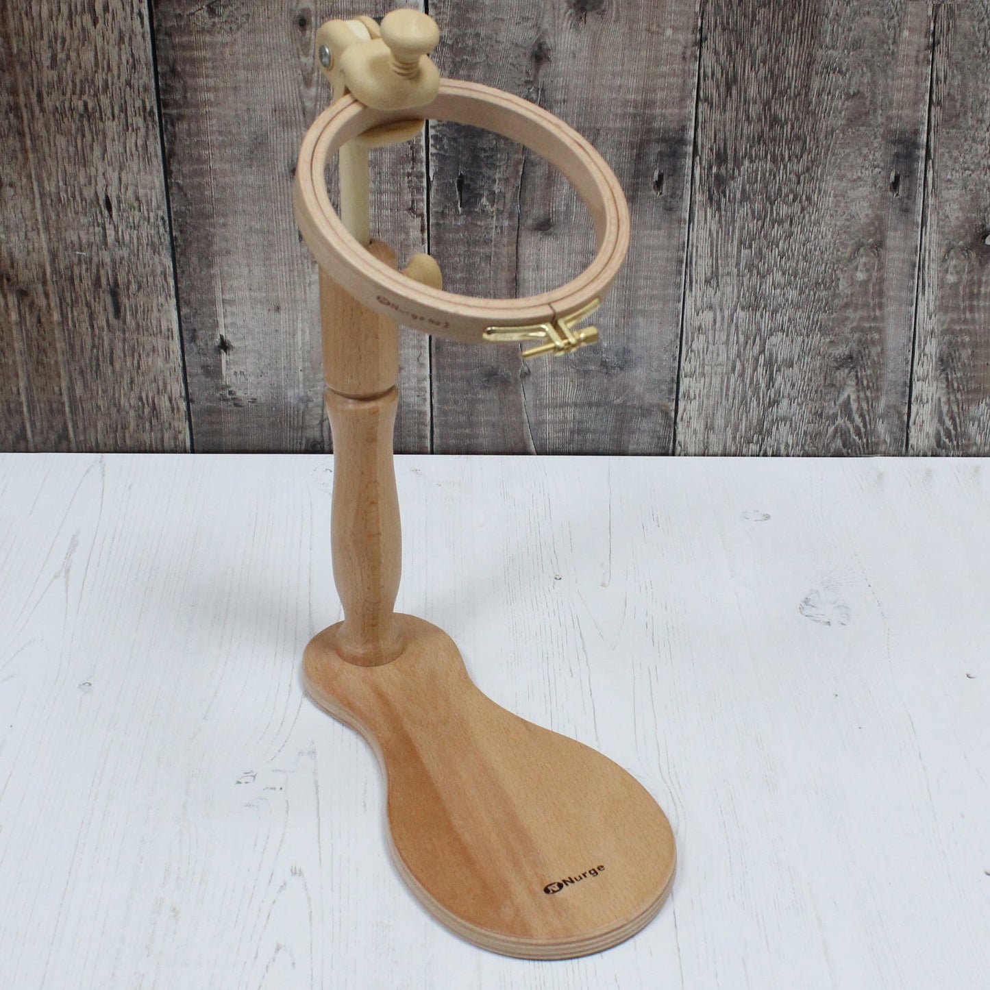 Wooden apparatus to assist with hand embroidery.